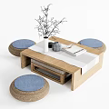 Rustic Wooden Tea Table with Woven Blue Cushions and Decorative Vase Twigs Book