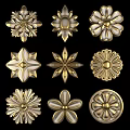 Various Golden Flower Shaped Decorative Ornaments Featuring Intricate Patterns 3d model