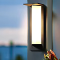 Modern Minimalist Wall Lamp With Black Frame And White Shade Emitting Warm Light