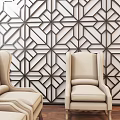 Geometric Patterned Wall in Modern Interior With Interlaced Lines Star Shapes and Beige Chair