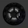 Motorcycle Tire With Black Rubber Tread And Alloy Wheel Rim Design