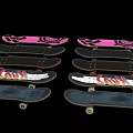 Multiple Skateboards With Various Graphic Patterns Including Gear And Wave Designs