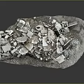 Collection of White Broken Stone Fragments on Tray with Dark Background