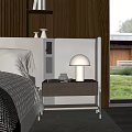 Modern Bedroom Interior With Wooden Side Cabinet White Lamp Books And Green Grass View