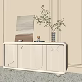Modern Elegant White Entryway Cabinet Sideboard With Curved Lines Decorative Painting Vase and Green Plant