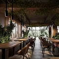 Elegant Restaurant Interior With Hanging Green Plants Wooden Tables Leather Seats And Natural Light