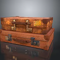 Vintage Leather Suitcases Stacked with Metal Locks and Name Tags