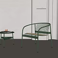 Green Metal Frame Lounge Chair With Woven Seat And Side Table In Minimalist Interior