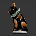 Ceramic Dog Figurine With Black Brown Fur And Green Collar On White Base