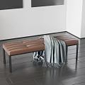 Brown Leather Stitched Bench With Gray Blanket And Black Metal Legs In Modern Interior