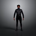 A Man Standing Against Dark Background Wearing Black Jacket Pants And Shoes