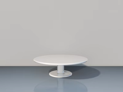 White Round Table With White Base On Gray Floor And Gray Wall 3d model
