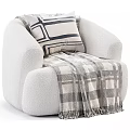 Cozy Beige Single Sofa With Striped Pillow Plaid Throw Blanket And Matching Ottoman