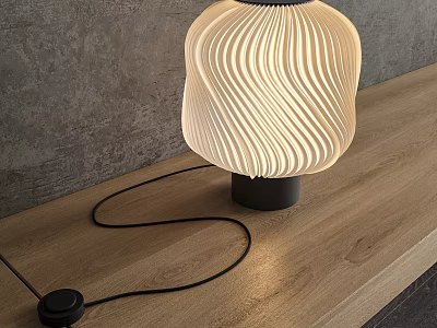 Modern Wavy Lampshade Table Lamp With Warm Light On Wooden Table Against Gray Wall 3d model