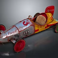 Vintage Rocket Toy Race Car With Silver Yellow Red Body And Green Wheels