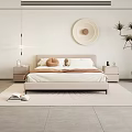 Modern Double Bed With Light Colored Bedding Bedside Table Lamp Round Decor And Green Plant