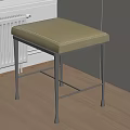 Beige Padded Sofa Stool With Metal Legs Placed In Wooden Floor Room Corner Near Radiator