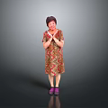 Woman Standing In Floral Dress With Clasped Hands And Purple Shoes On Gray Background