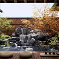 Miniature Garden Landscape with Rock Waterfall Small Pond and Colorful Trees by Wooden Fence