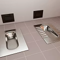 Stainless Steel Squat Toilets on Tiled Bathroom Floor with White Walls