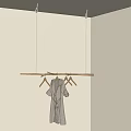 Wooden Hanger Ceiling Hung With Gray Robe and Empty Hangers Against Light Gray Walls