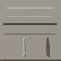 Hanging Clothes Racks Mounted on Wall With White And Gray Clothes And Small Decorative Item
