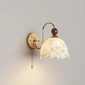 Elegant Vintage Brass Wall Lamp With Curved Arm Round Base And Patterned White Linen Shade