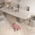 Modern Dining Table Set With Gray Chairs And Decorations On Light Colored Wooden Floor