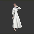 Woman in White Long Dress Standing with Hand Near Face on Grey Reflective Floor Background