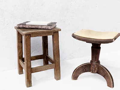 Two Vintage Wooden Stools with Stacked Books and Upholstered Seat Design 3d model