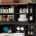 Kitchen Spice Jars Arranged On Black Cabinet Shelves With White Plates