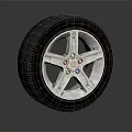 Stylish Car Tire With Silver Five Spoke Wheel Rim And Detailed Design