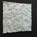 Elegant White Wall With Intricate 3D Relief Floral Scroll Patterns And Carved Details