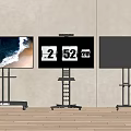 Iron Art Wheeled Floor Stands Supporting 60 Inch Screens In Modern Setting