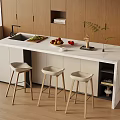 Kitchen Island Dining Set With White Countertop Three Bar Stools Fruits Wooden Cabinets And Plants