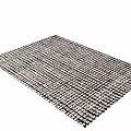 Black and White Woven Square Rug With Intricate Textured Surface and Plush Weave