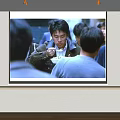 Projection Monitoring Live Feed Displayed on Large Screen Showing Group Interaction