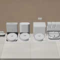 Modern Robotic Vacuum Cleaners And Home Appliances Displayed Neatly On White Floor
