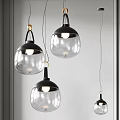 Modern Transparent Glass Pendant Lights With Black Frame Hanging In Room