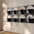 Modern Minimalist Black Wall Mounted Shelf With Circular Compartments And Decor Pieces