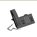 Gray Office Desk Phone With Keypad And Coiled Cord On Wooden Table