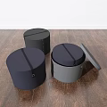 Round Storage Stools in Black Navy Blue and Gray with Open Lid on Wooden Floor