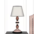 Elegant Wooden Layered Table Lamp With Beige Fabric Lampshade On Bedroom Bedside Table