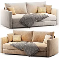Cozy Beige Two Seater Sofa With Textured Pillows And Knit Blanket
