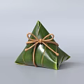 Traditional Chinese Zongzi Wrapped in Green Bamboo Leaves Tied with Brown String in Triangular Shape
