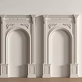 Double White Classical Carved Door Arches With Decorative Details On White Wall And Wooden Floor