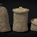 Three Different Sizes Burlap Sacks Filled With Corn Kernels For Household Storage