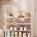 White Multi tier Shoe Rack with Slippers Sneakers Decorative Dolls Wicker Basket and Green Plants