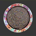 Delicious Chocolate Cake with Chocolate Frosting and Colorful Sprinkles on Floral Pattern Plate Black Background