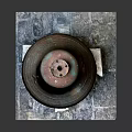 Musical Instruments and Painting Tools Display with Rusted Bronze Bell on Stone Slab Base